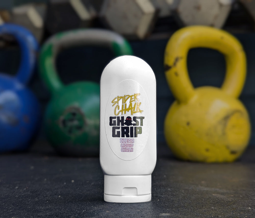 bottle of clear liquid chalk and kettlebell