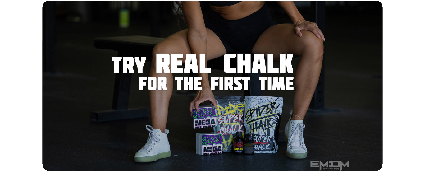 Person sitting with spider chalk boxes labeled 'Real Chalk' and 'Mega Chalk' on a dark background.