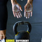 girl with chalky hands and a kettlebell about to workout