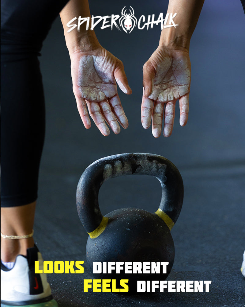 girl with chalky hands and a kettlebell about to workout