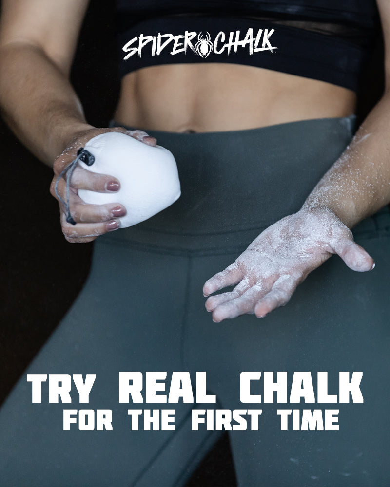 refillable chalk ball in hand and powder chalk on arm in gym environment